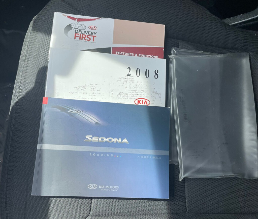 Picture of: Kia Sedona owners manual with supplements and case