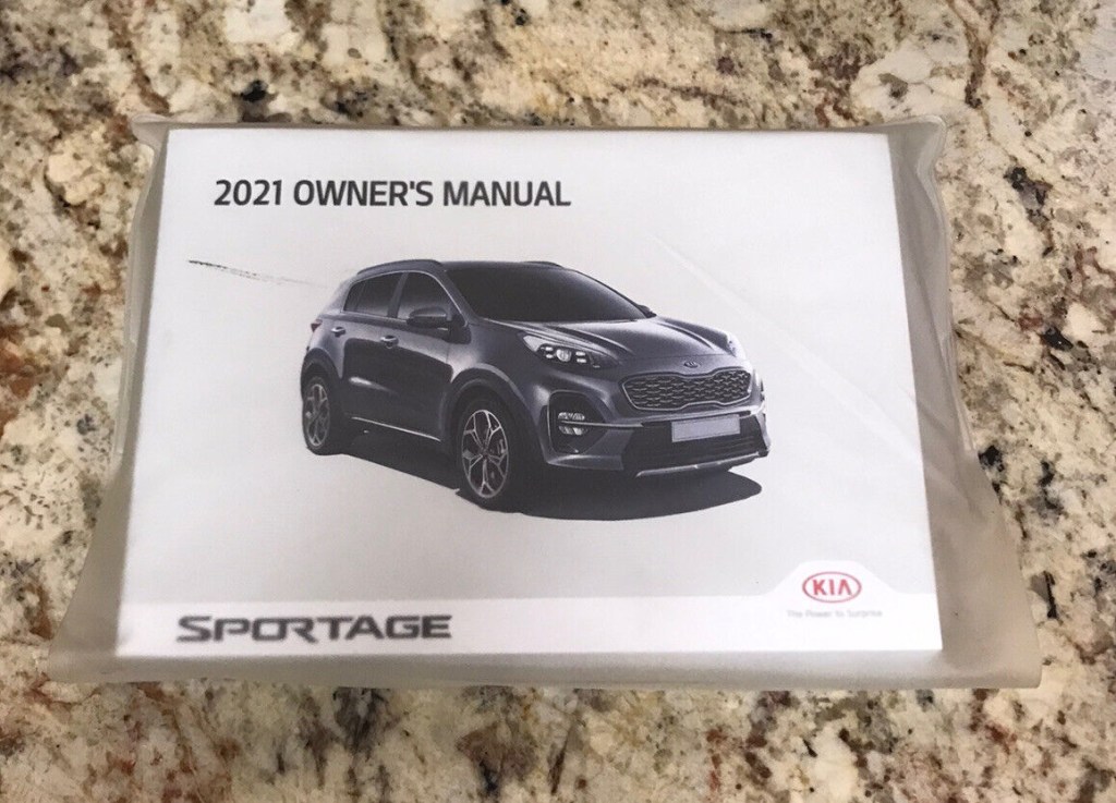 Picture of: Kia Sportage Owners Manual With Case *OEM*  eBay